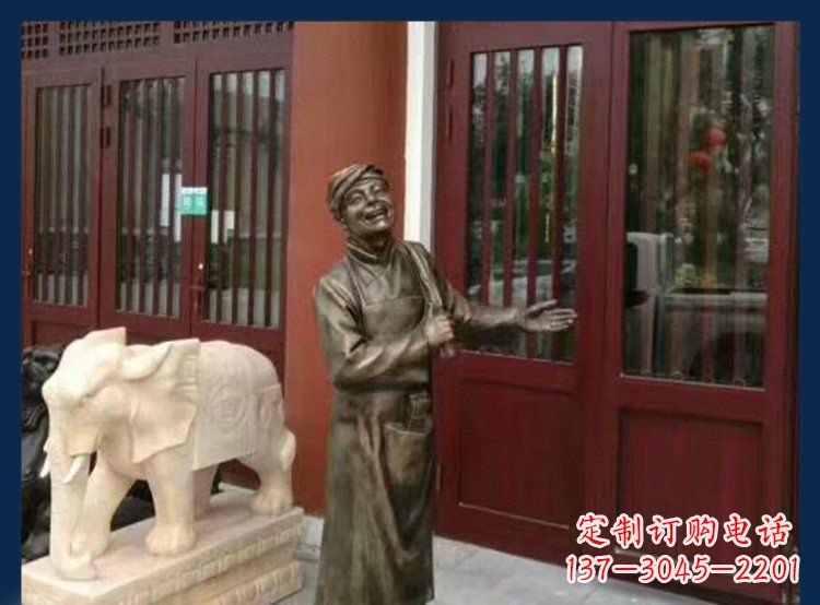 哈尔滨铜雕店小二酒店迎宾人物雕塑