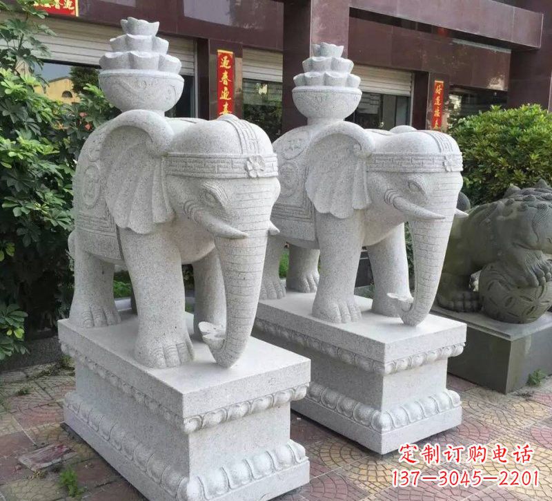 哈尔滨驮元宝的大象石雕