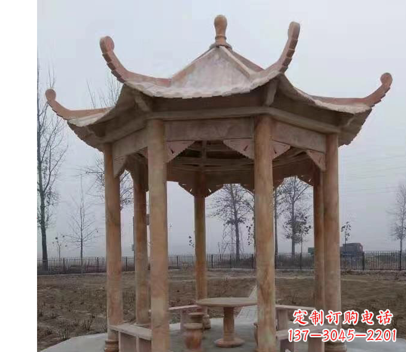 哈尔滨公园晚霞红八角石雕凉亭